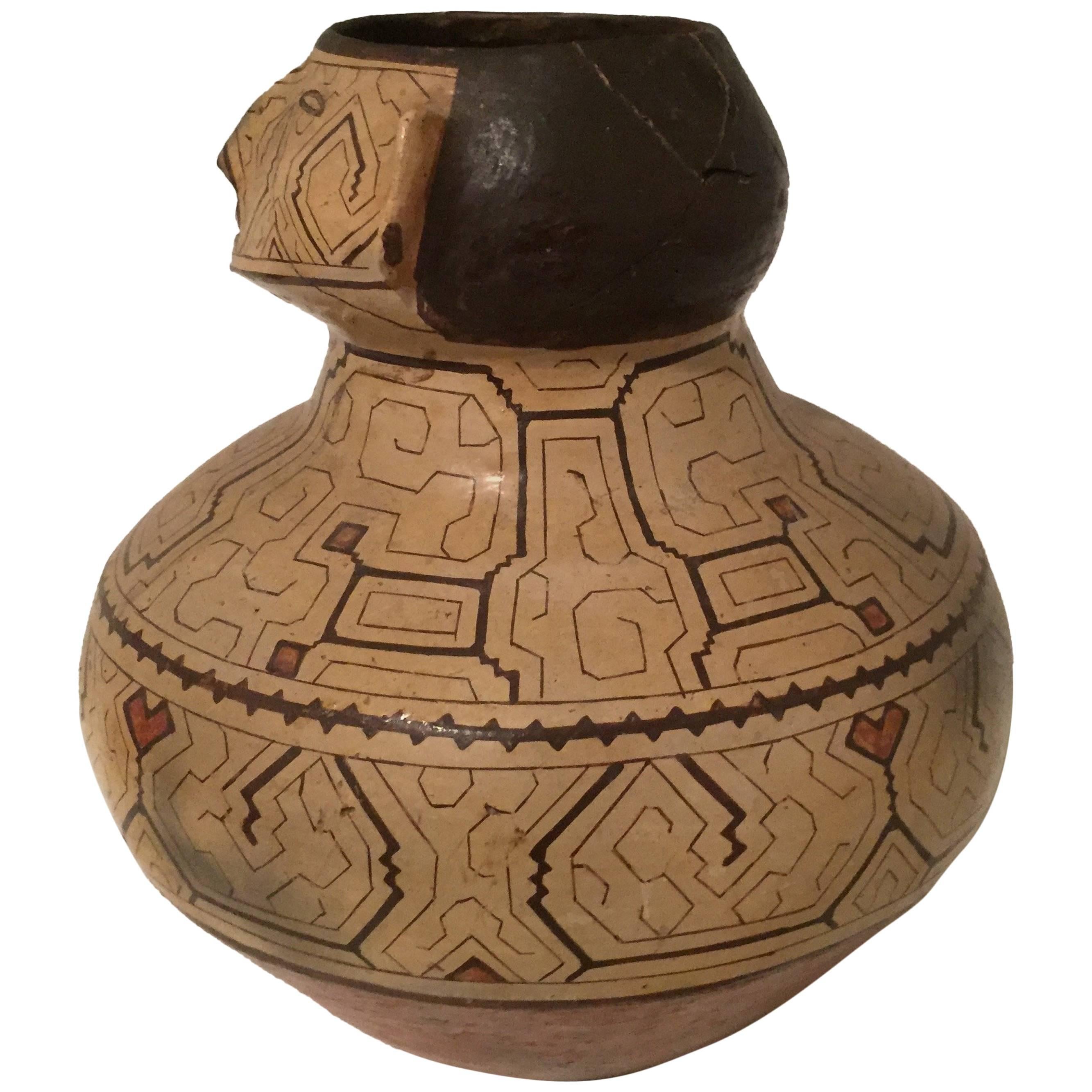  Offered by J R Richards
Shipibo pottery urn or vessel. Nicely sculpted face at neck with a well rounded body. General staining consistent with age and tribal use, Peru, early to mid-20th century.
12