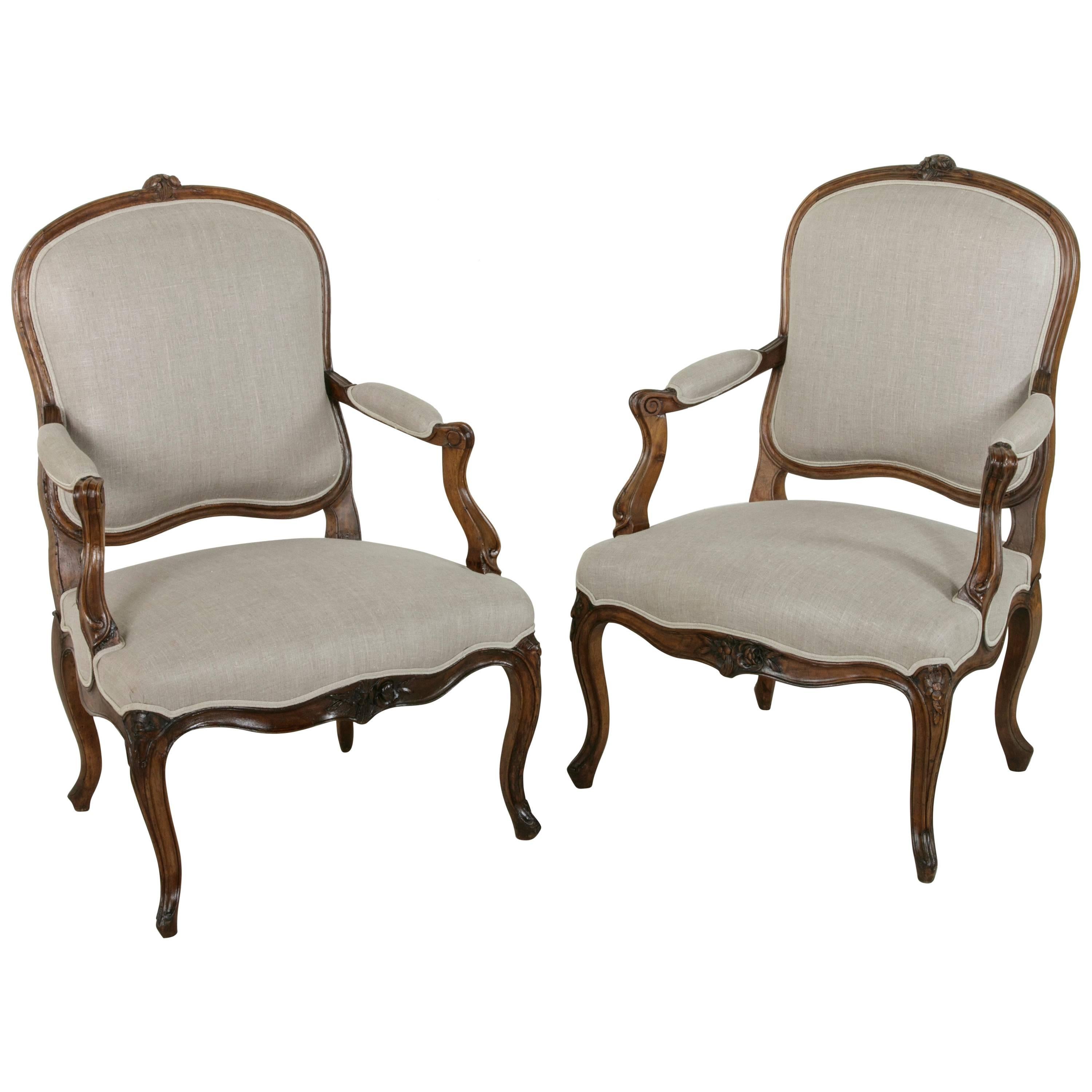 Pair of 19th Century Hand Carved Walnut French Louis XV Style Armchairs in Linen