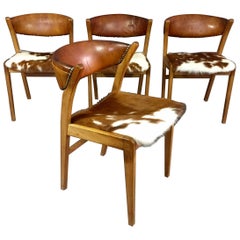 Four Danish 1960s Oak, Leather and Cowhide Dining Chairs