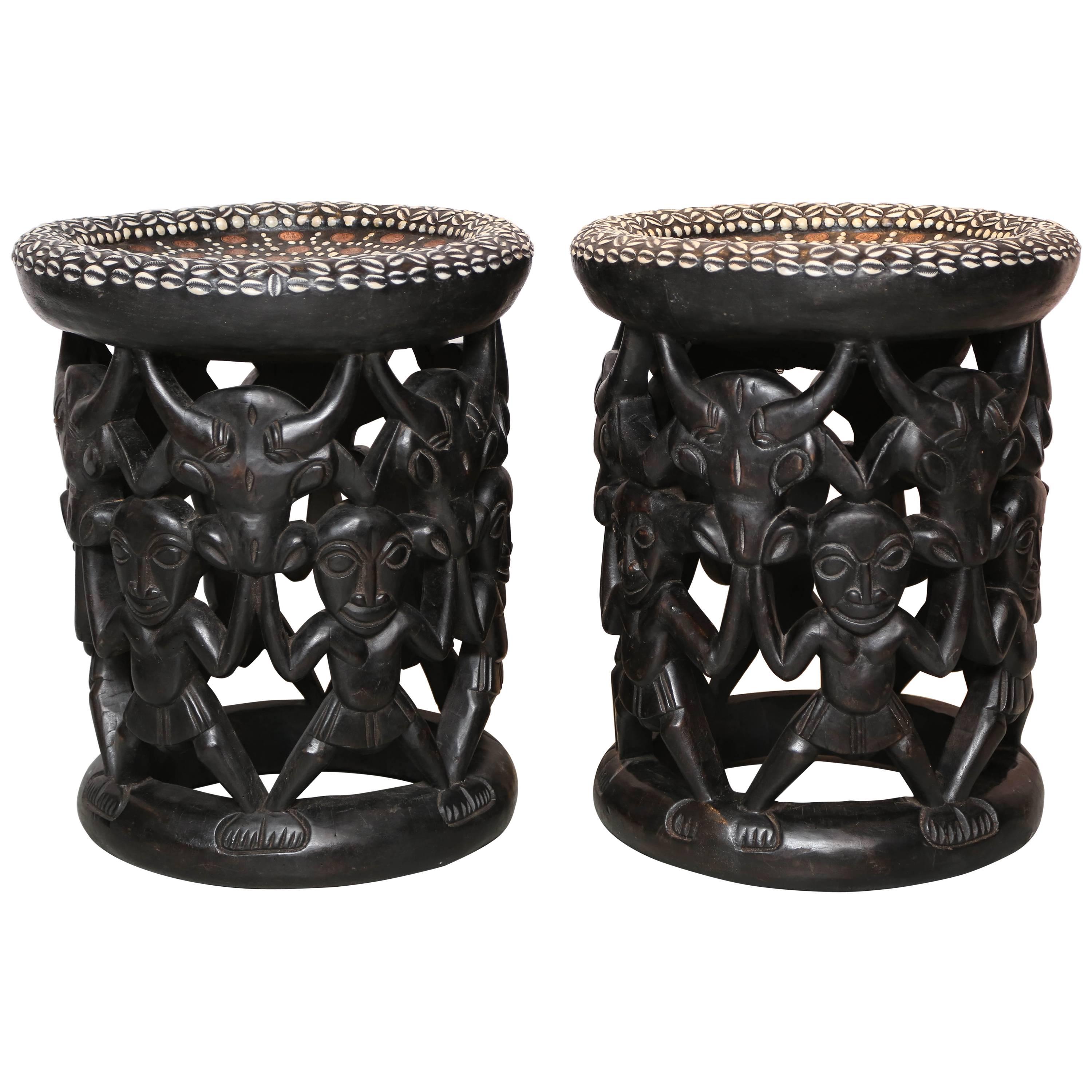 Pair of African Side Tables Extensive Woodcarving Top Inlaid Coins, Cowry Shells For Sale