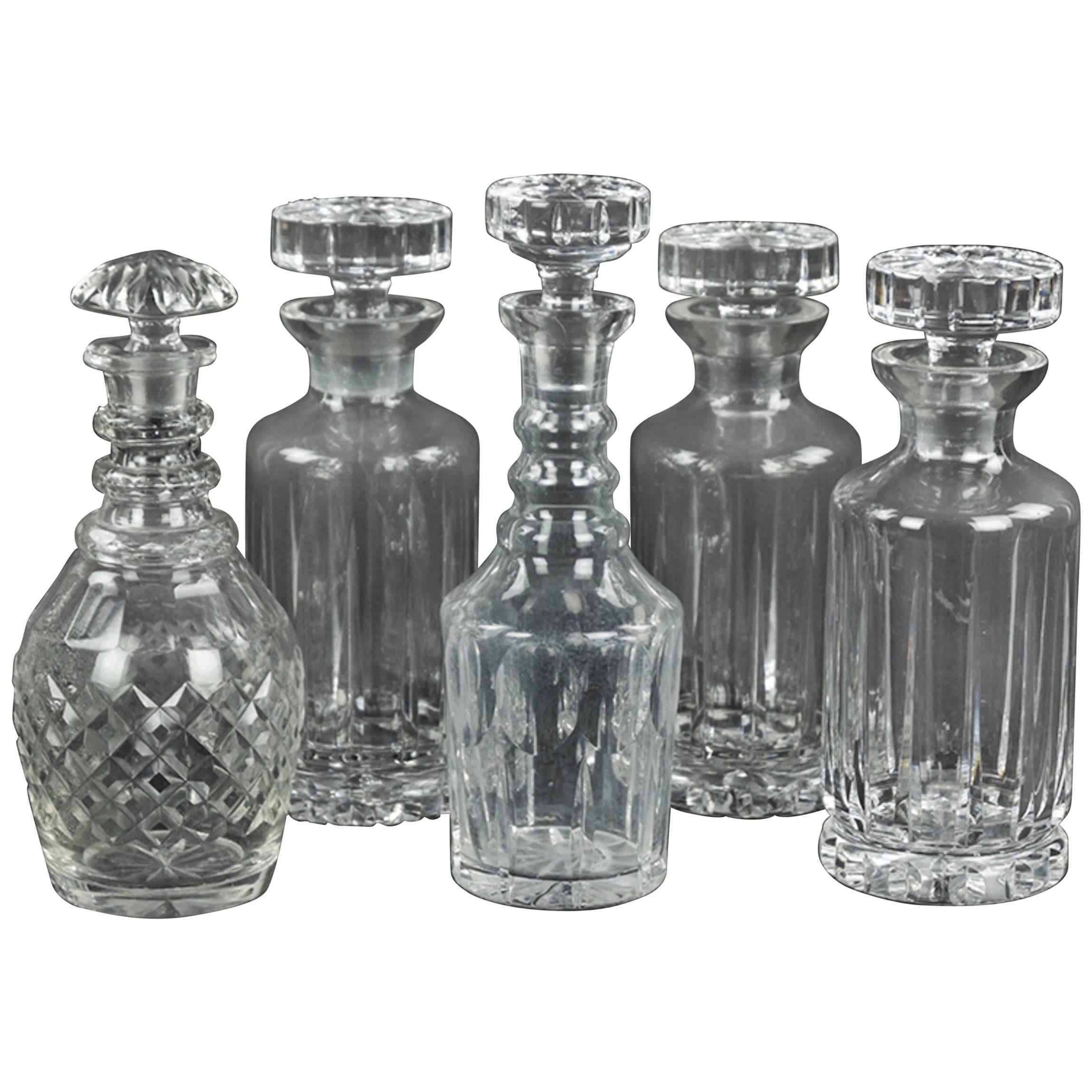 Collection of Ten Cut Glass Decanters of Various Forms and Makers.  