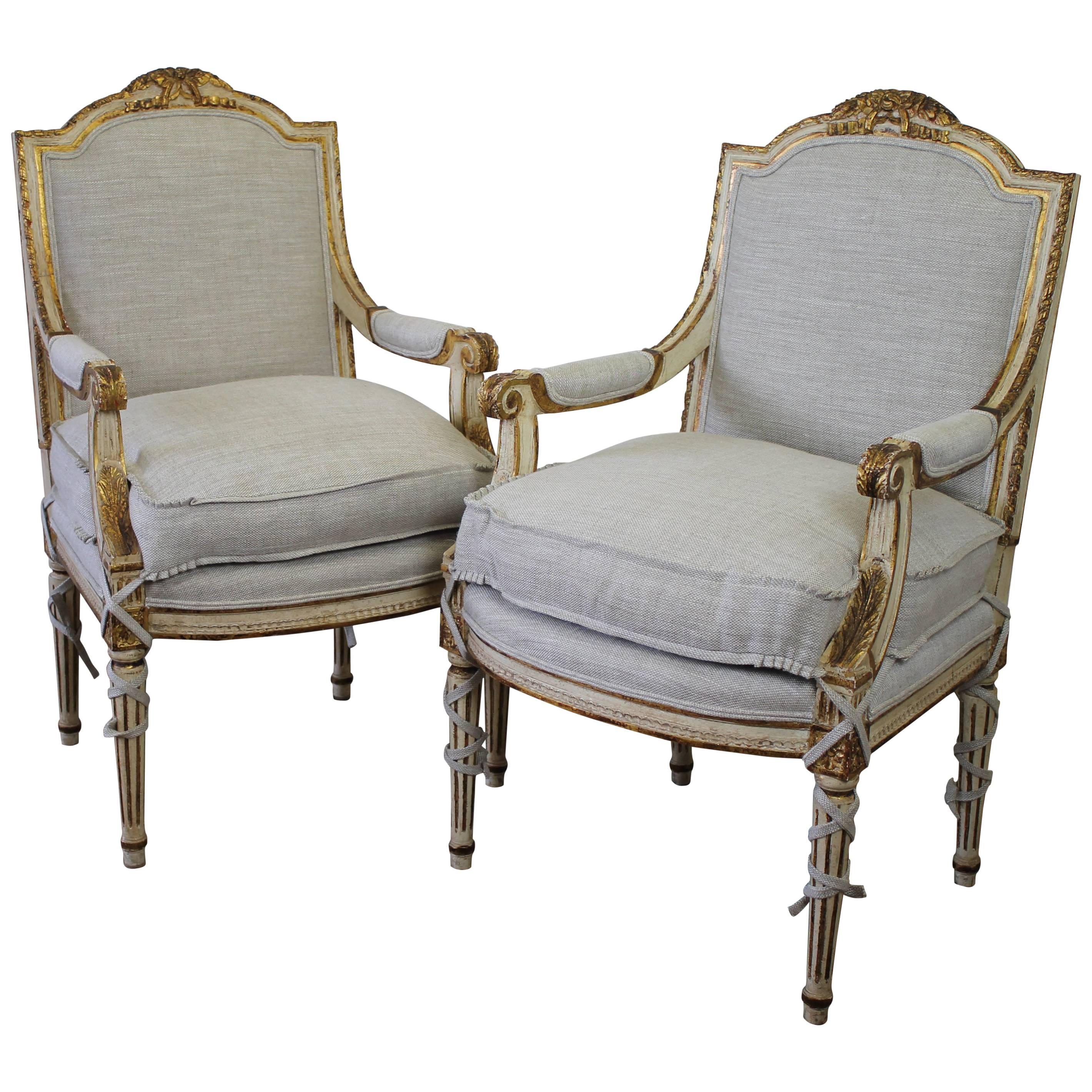 Pair of 20th Century Carved Painted and Gilt Upholstered Open Armchairs