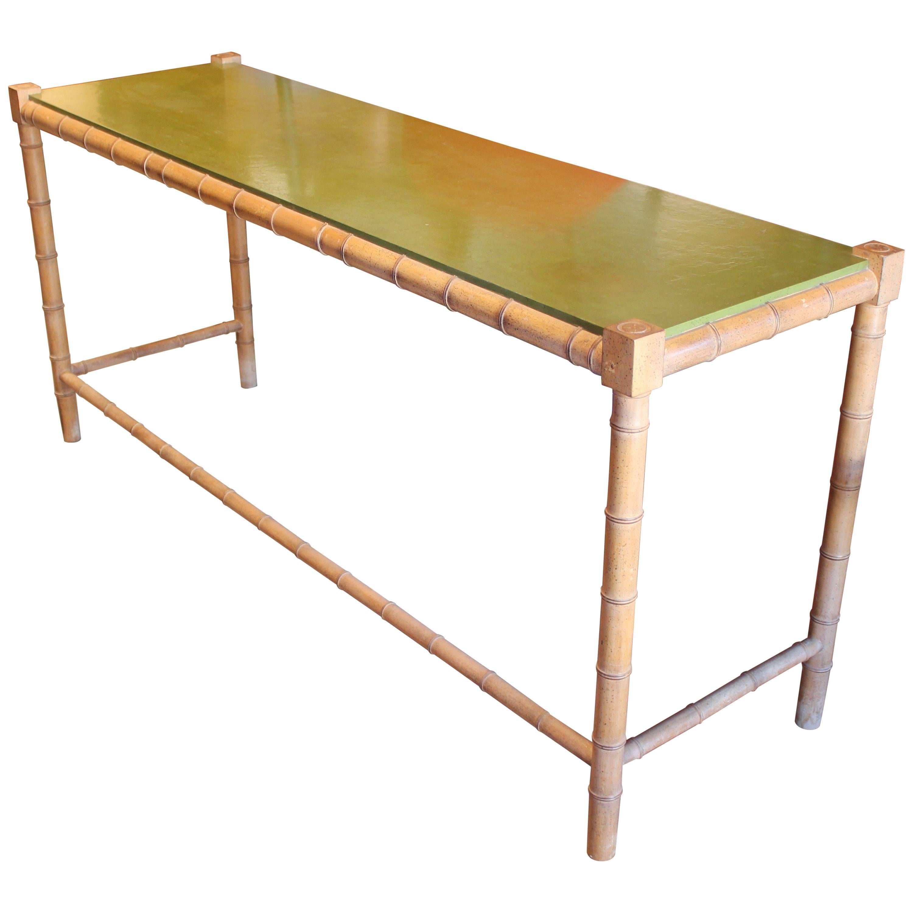 Unique faux bamboo and green top console or serving table. A multi-use table perfect for any space, even as a sofa table. Attributed to Henredon or Baker Furniture. In great vintage condition. 