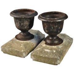 Antique 19th Century Pair of French Iron Urns on Stone Plinths