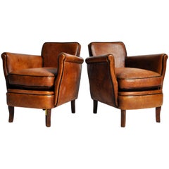 Pair of "Submarine" Brown Leather Club Chairs with Dark Piping 