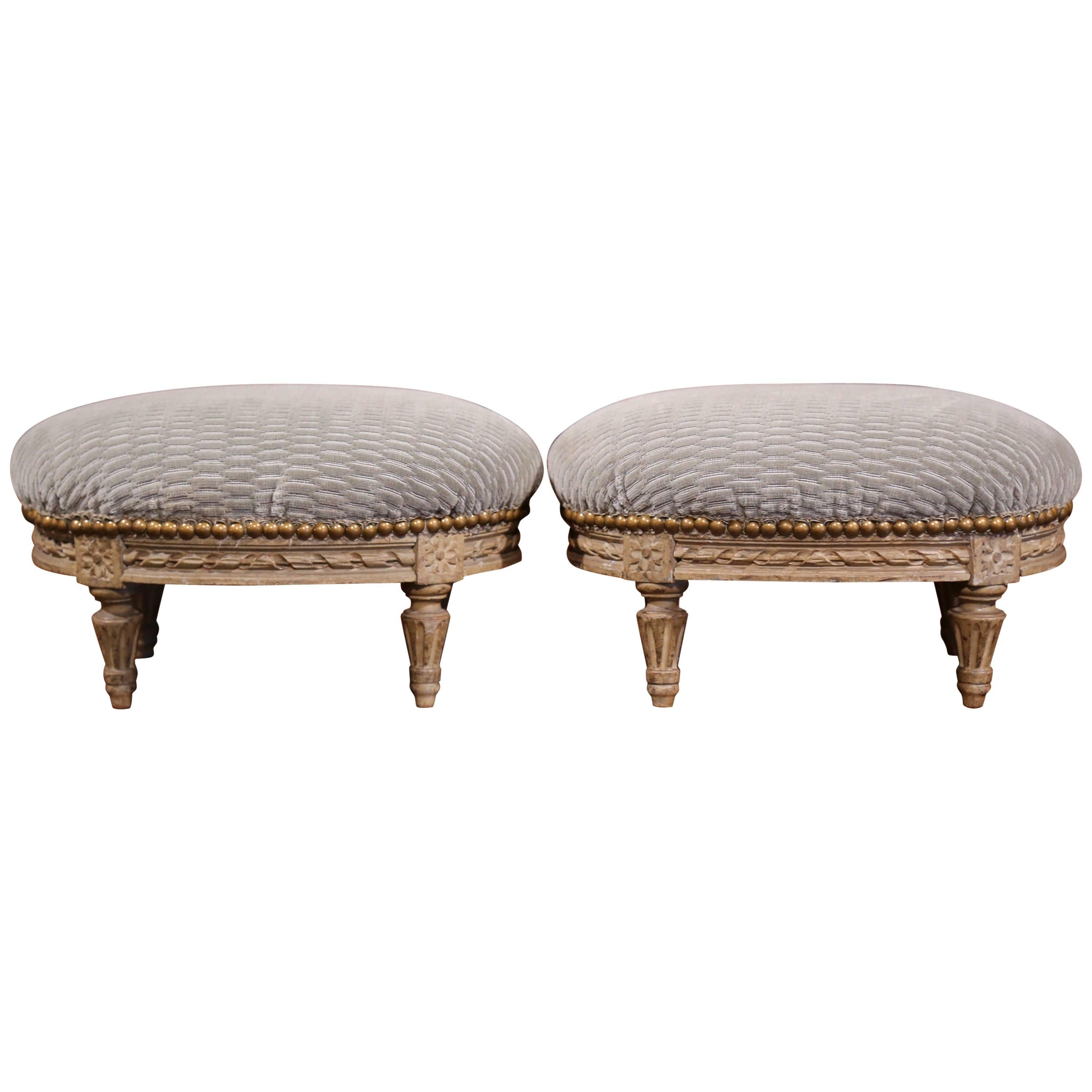 Pair of French Louis XVI Carved Painted Oval Footstools with Blue Velvet Fabric