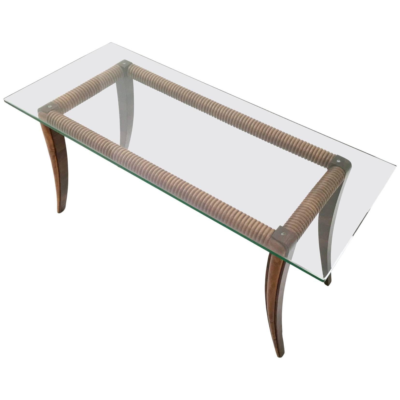 The structure of this beautiful coffee table is in maple and wood. It features a glass top, which is 1.2 cm thick.
It has been perfectly polished and it is in excellent original condition, ready to become a piece in a home.

Measures: Width 100