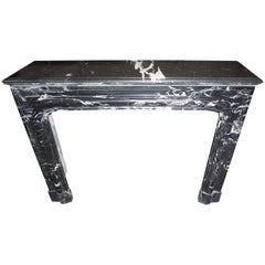 Louis XIV-Style Bolection Molded Black Saint Martin Marble Mantel