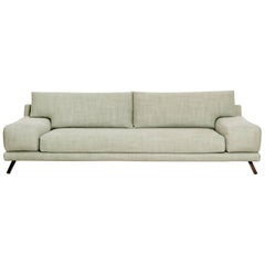 Sofa Ian in fabric and brass by French designer Christophe Delcourt