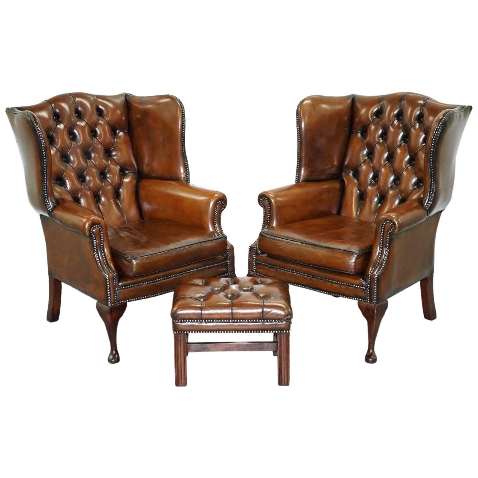 Pair of Hand-Dyed Cigar Brown Leather Chesterfield Wingback Armchairs and Stool