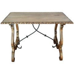 19th Spanish Farm Table with iron stretchers & hand carved top