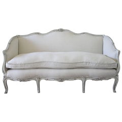 Antique 19th Century Carved and Painted Louis XV Style Sofa Upholstered in Organic Linen