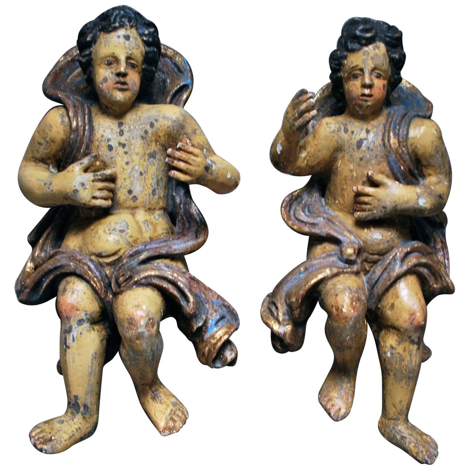 Large pair of 17th Century Polychromed Carved Wood Cherubs For Sale