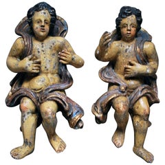 Large pair of 17th Century Polychromed Carved Wood Cherubs