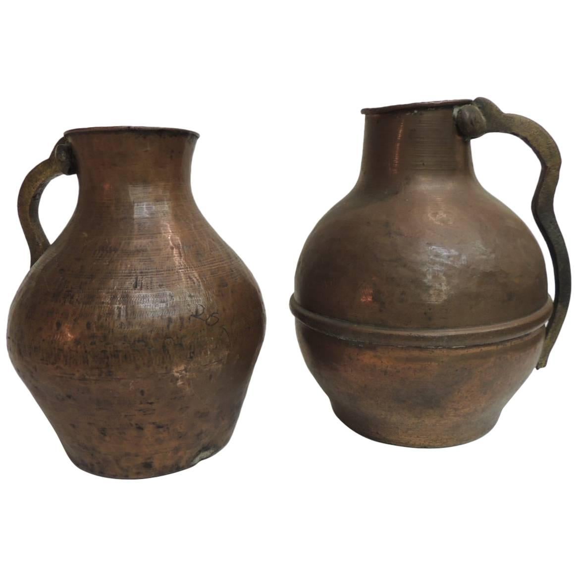Pair of Heavy Patina Persian Copper Water Jugs with Handles