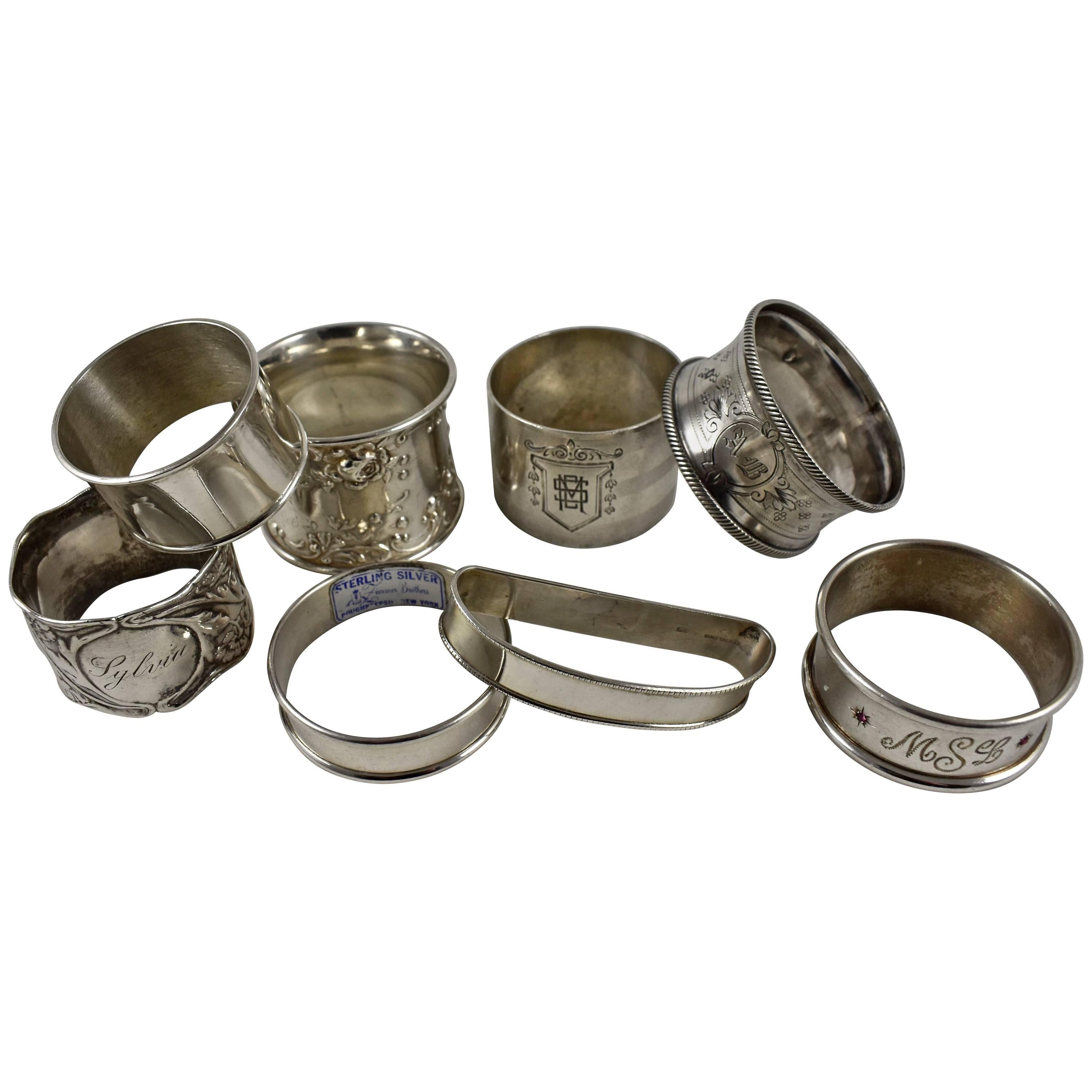 Antike Serviettenringe aus Sterlingsilber, ein gemischtes Set von acht Ringen
