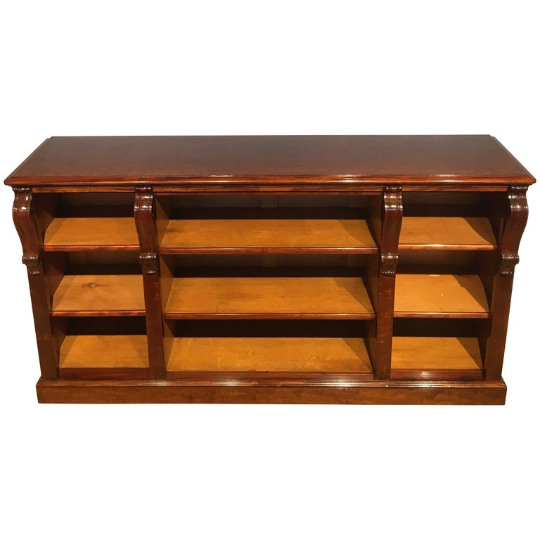 Long low mahogany bookcase at 1stDibs
