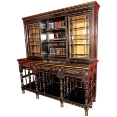 An Aesthetic Movement Ebonised Parcel-Gilt Display or Apothecary Cabinet