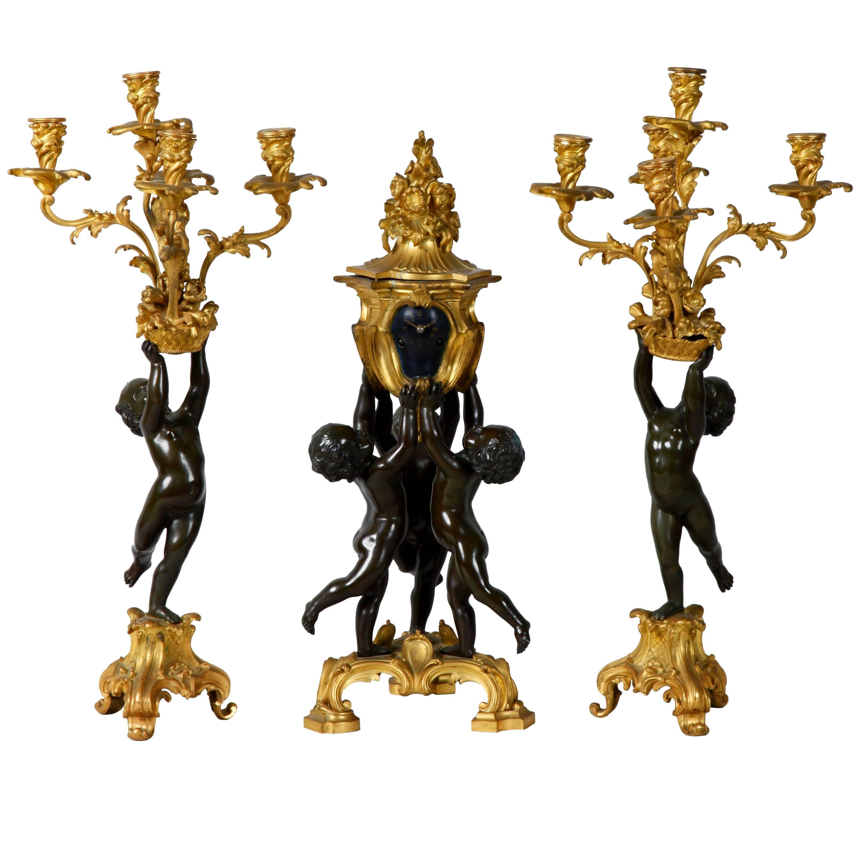 Raingo Freres Three-Piece Bronze Cherub Clock Set