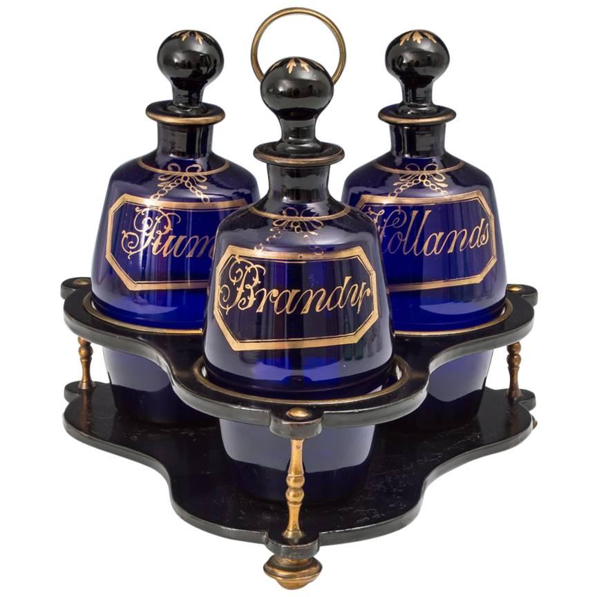Georgian Gilt and Black Lacquered Stand with Blue Barrel Decanters