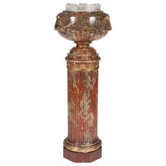 Bol en albâtre sculpté reposant sur une colonne cannelée, avec lumière