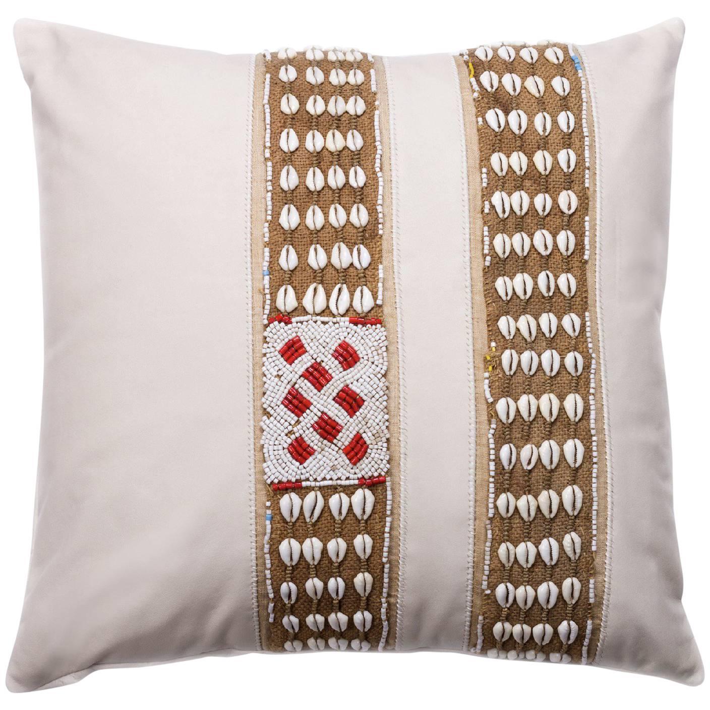 Antique African Trim on White Matte Leather Pillow