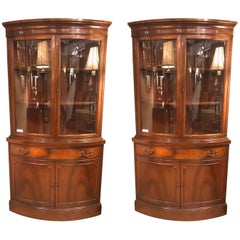 Pair of Georgian Style Mahogany Two-Door Bow Front Corner Cabinets