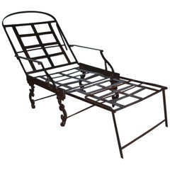 Sillón de campaña victoriano de hierro plegable