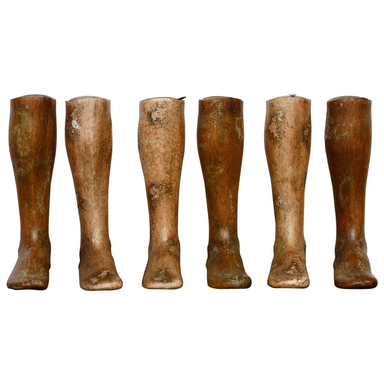 Fabulous set of six, 19th century wooden riding boot molds or boot forms. Features a solid hardwood construction and all six similarly sized. Each has a hook on the top allowing them to be hung on a wall for display. They all have a beautifully