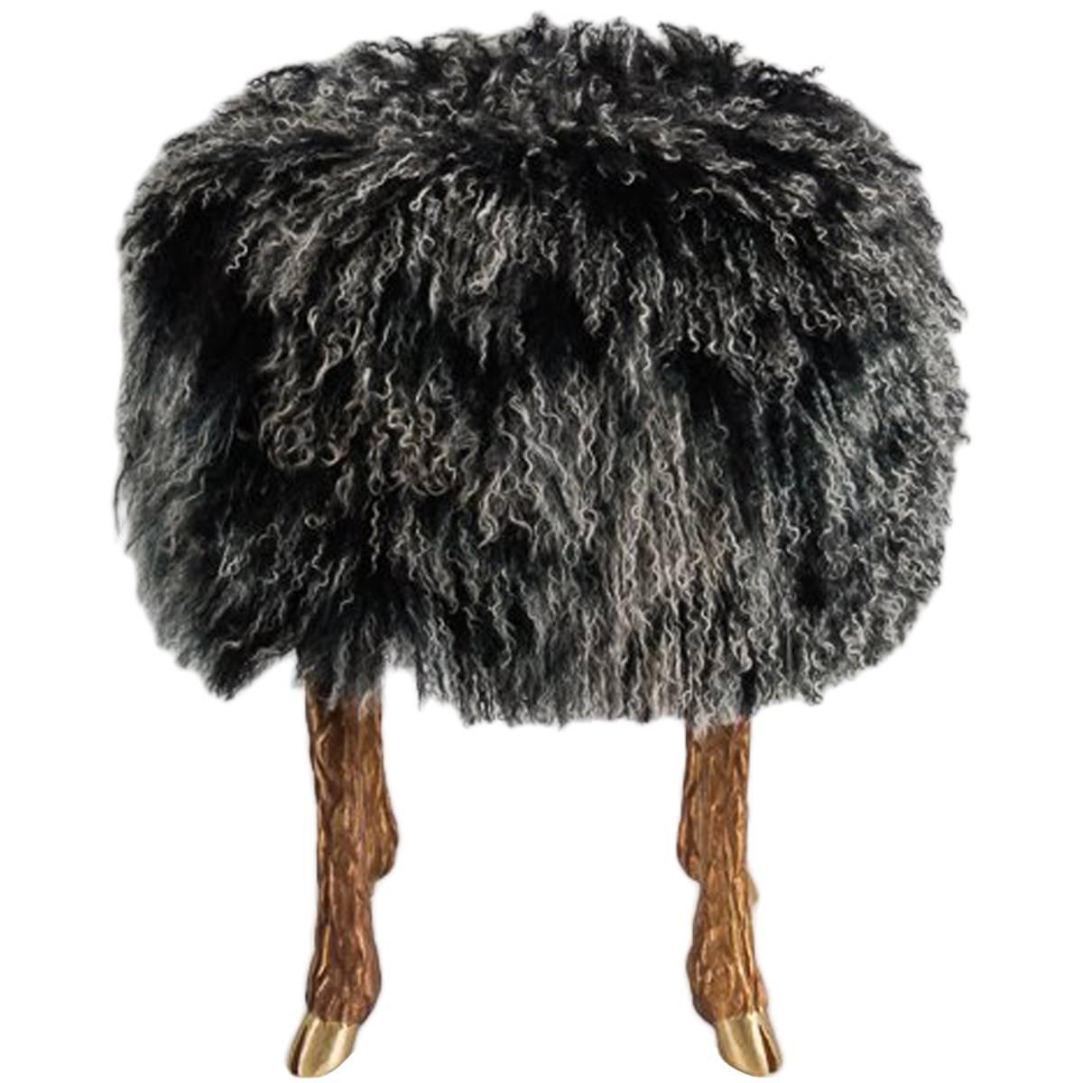 This surrealistic stool, which rests on silver or bronze legs modeled after a goat's, and is upholstered in lamb's wool, is a successful new take on a centuries-old tradition: transforming the pastoral into exceptional, lush decor.
