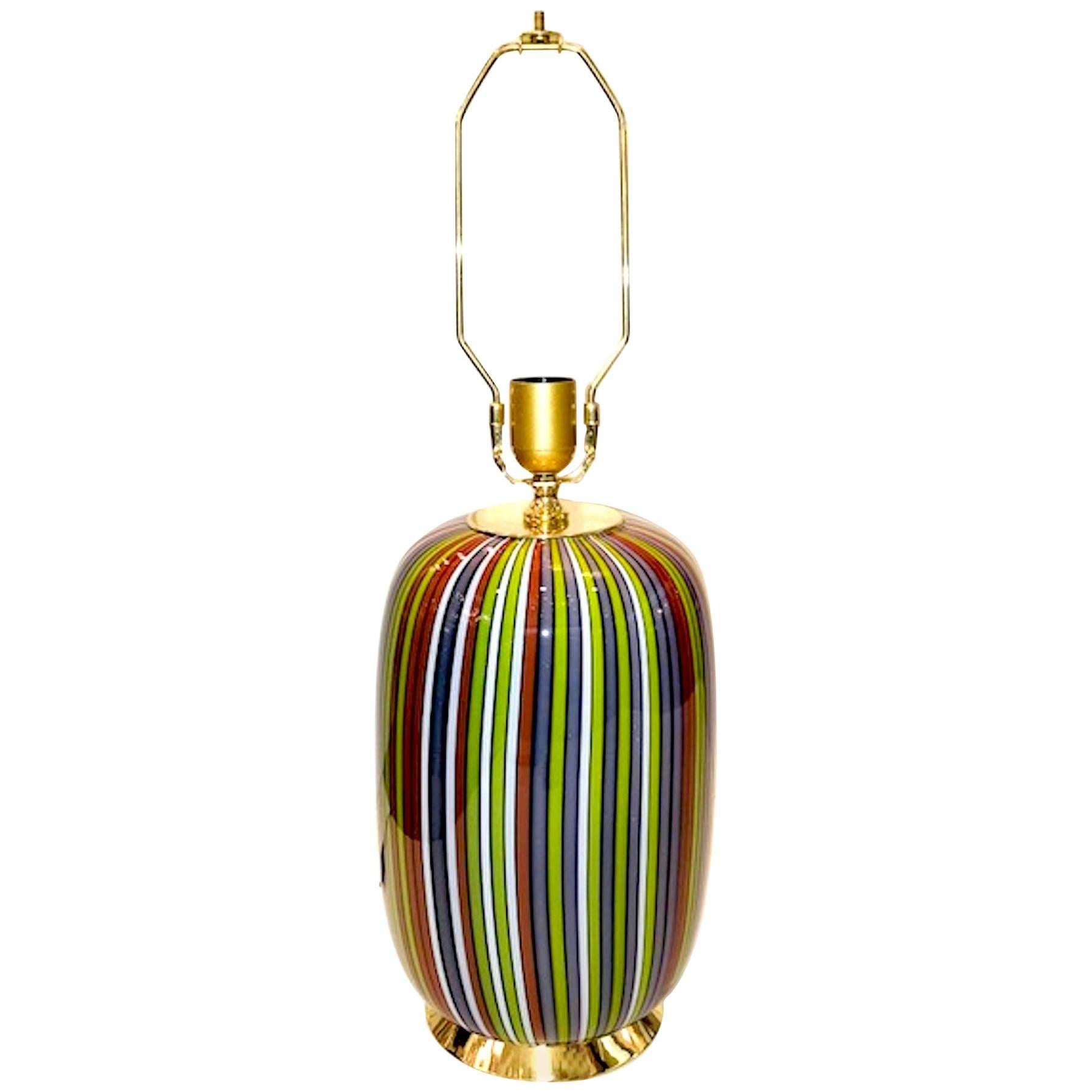 Beautiful 1980s hand blown table lamp by Italian glass house Ve Art. Glass is blown with a design in stripes of blue-grey, white, black, green and burgundy-brown stripes.  Brass mounts polished and lacquered. Rewired. Shade for display and not