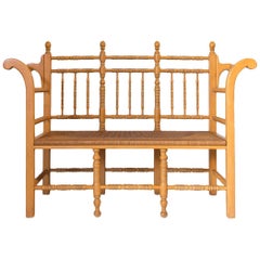 Edwardian Style Light Oak Spindle Bench with Rush Seat and Curved Arms