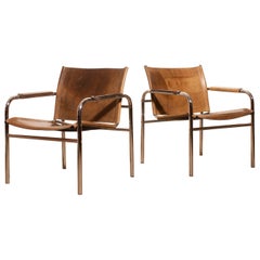 1960s , Two Leather and Tubular Steel Arm Chairs 'Klinte' by Tord Björklund