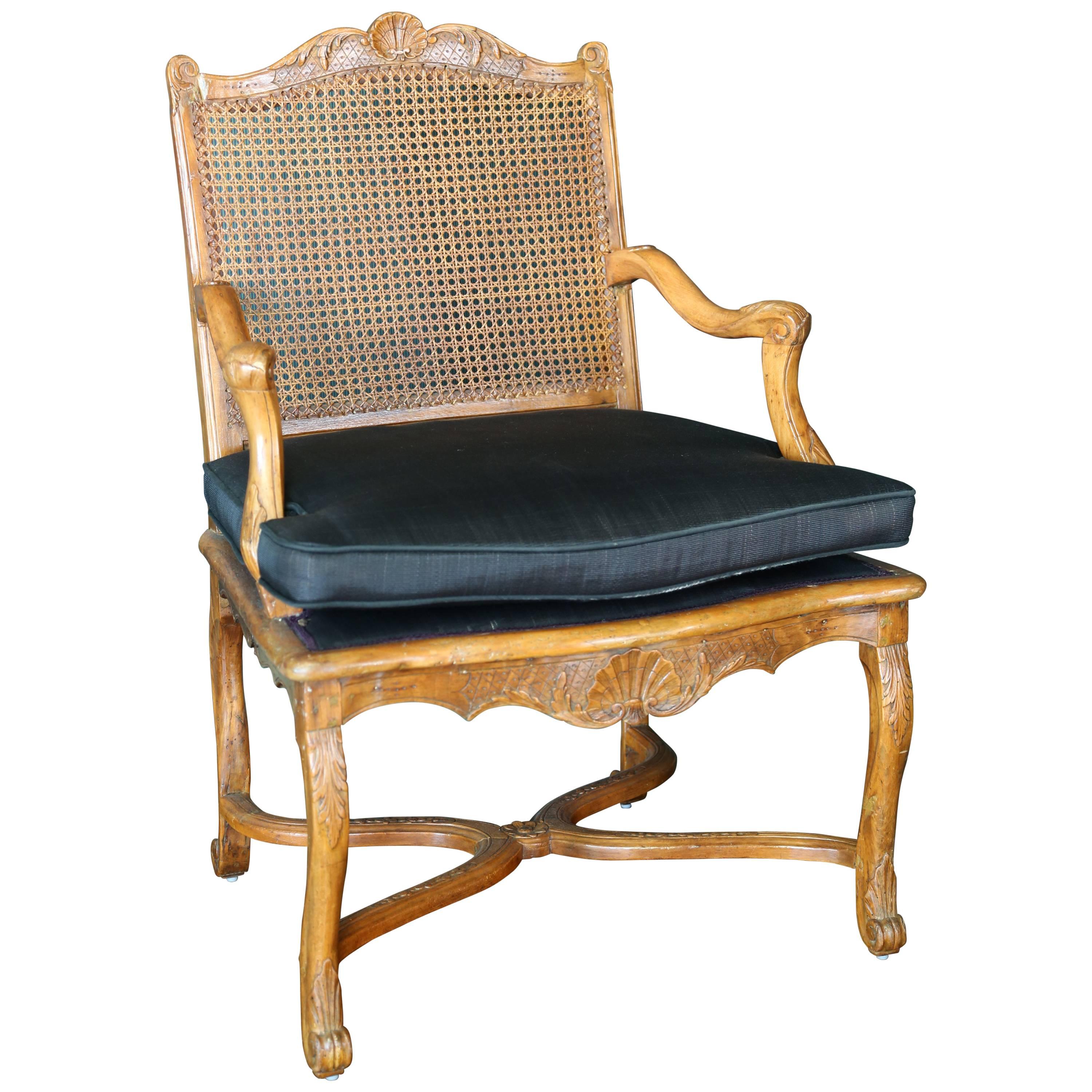 French Régence Carved and Caned Beechwood Fauteuil