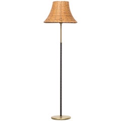 Floor Lamp in Black Leather, Brass and Woven Cane Shade Produced in Sweden