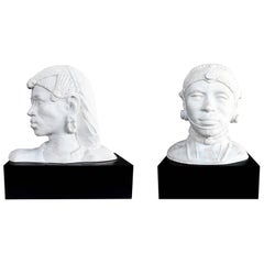 Pair of Resin African Busts with Plaster Finish on a Black Wooden Pedestal