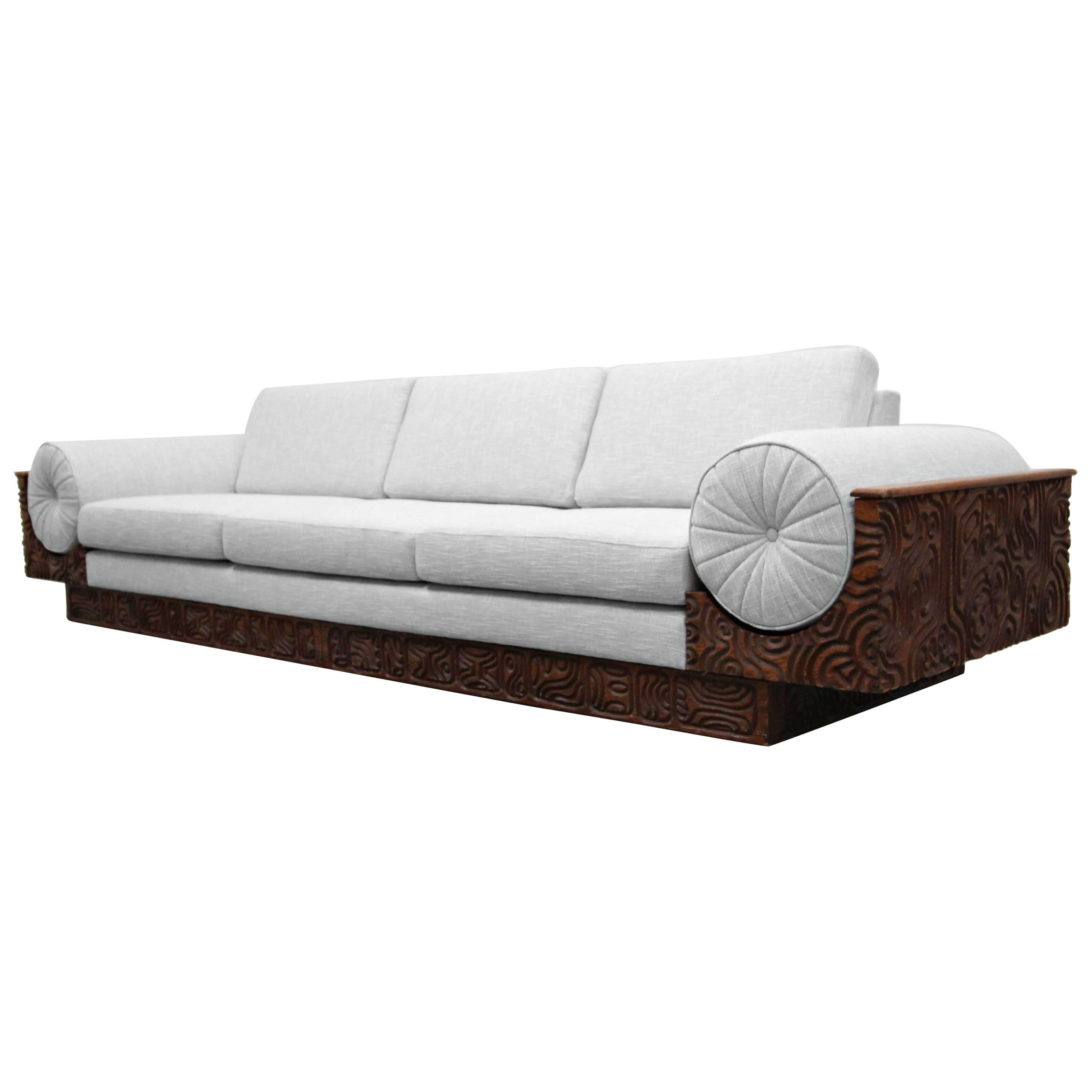 There are no words.

This monumental sofa is a design masterpiece.  With intricate and intriguing carved wood details, this is a conversation piece to behold.  Lending itself to designs by Everlyn Ackerman and Murray Feldman.  Sofa is in excellent