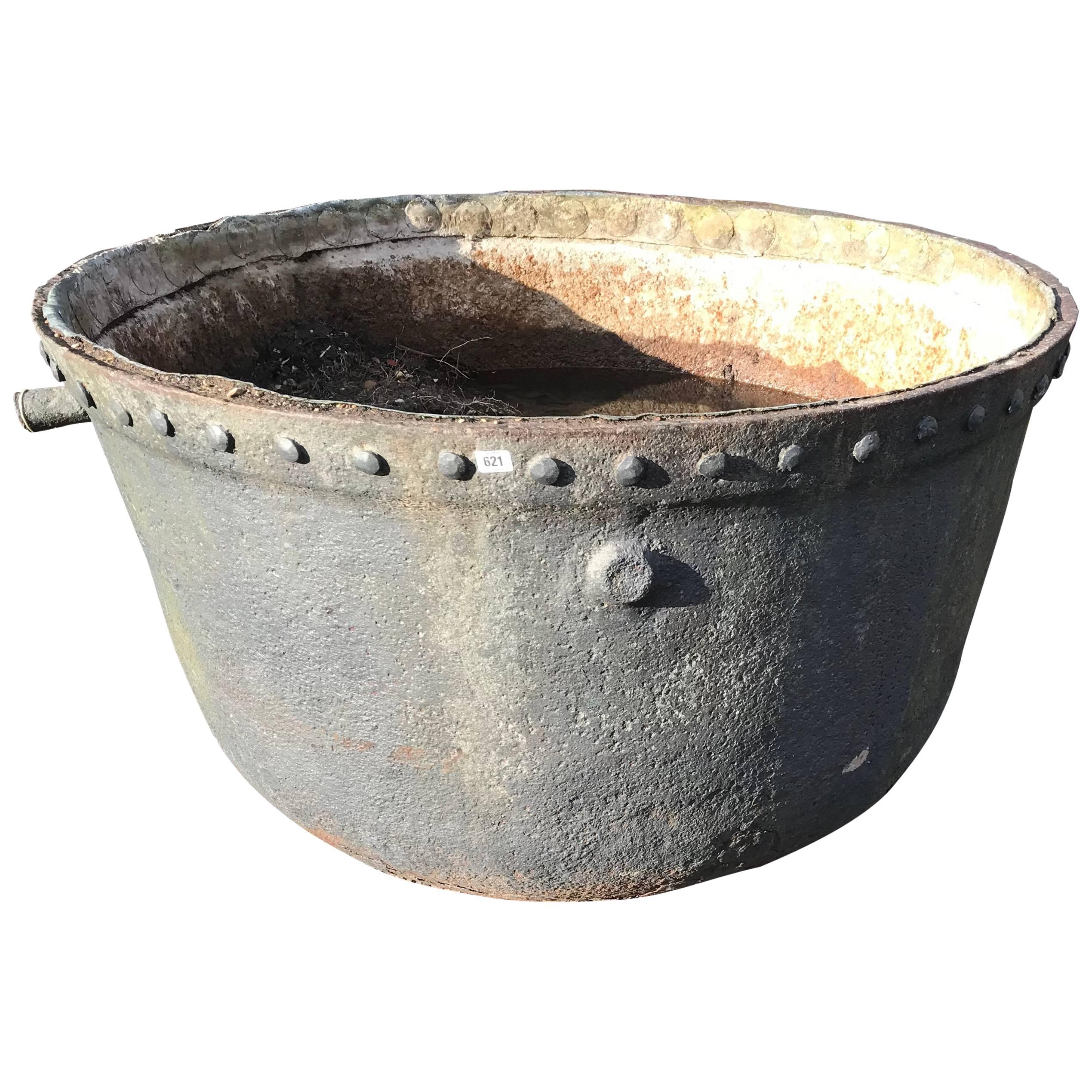 A LARGE LATE 19TH/EARLY 20TH CENTURY CAST IRON STUDDED Cauldron