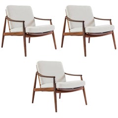 Peter Hvidt and Orla Mølgaard-Nielsen 1950s lounge chairs in teak and rattan
