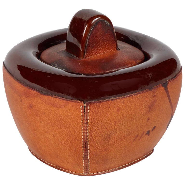A Small Pottery Jar with Brown Leather Decoration and Lid For Sale at