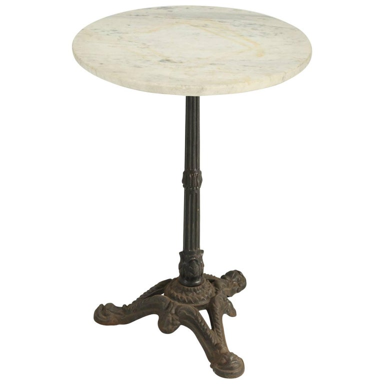 French Bistro Table in Carrera Marble with a Cast Iron Base at 1stDibs