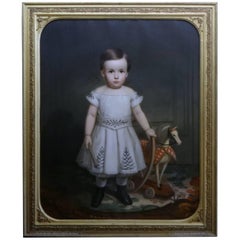 19th Century American School Primitive Portrait of a Child with Hobby Horse