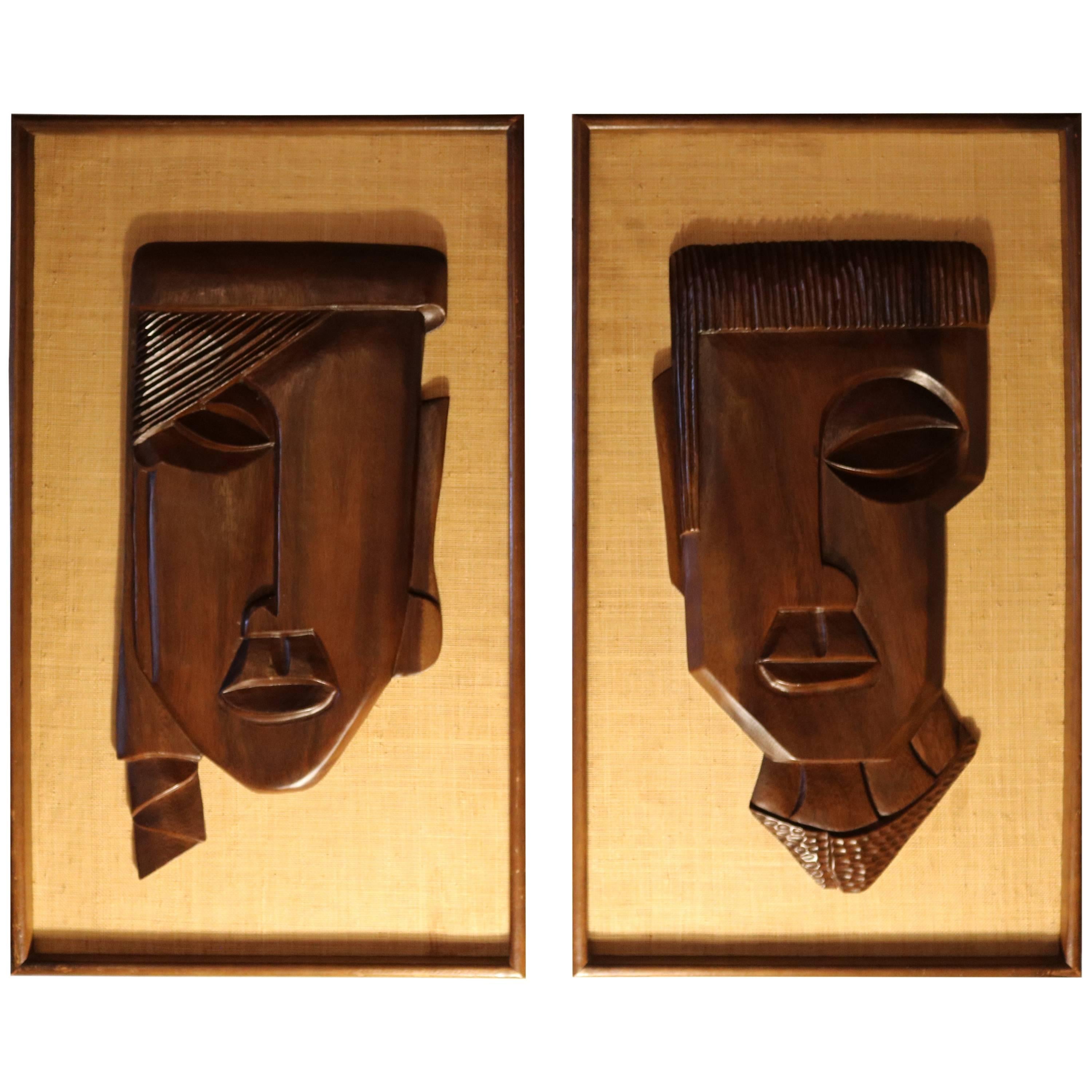Pair of Framed Carved Brown Rosewood African Faces