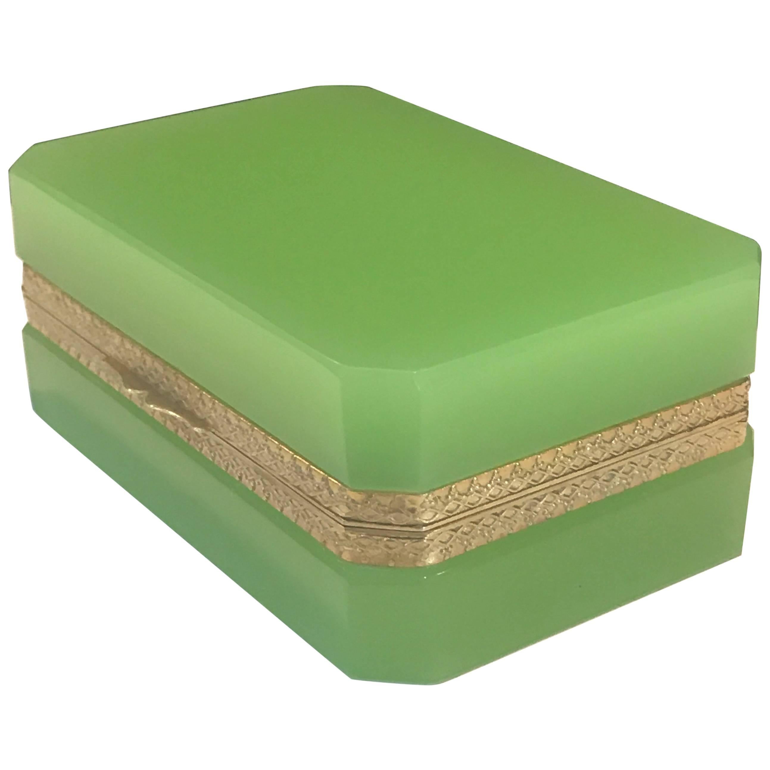 Green opaline ormolu-mounted box, rare shade of green, with cross cut corners and finely cast ormolu bronze mounts.