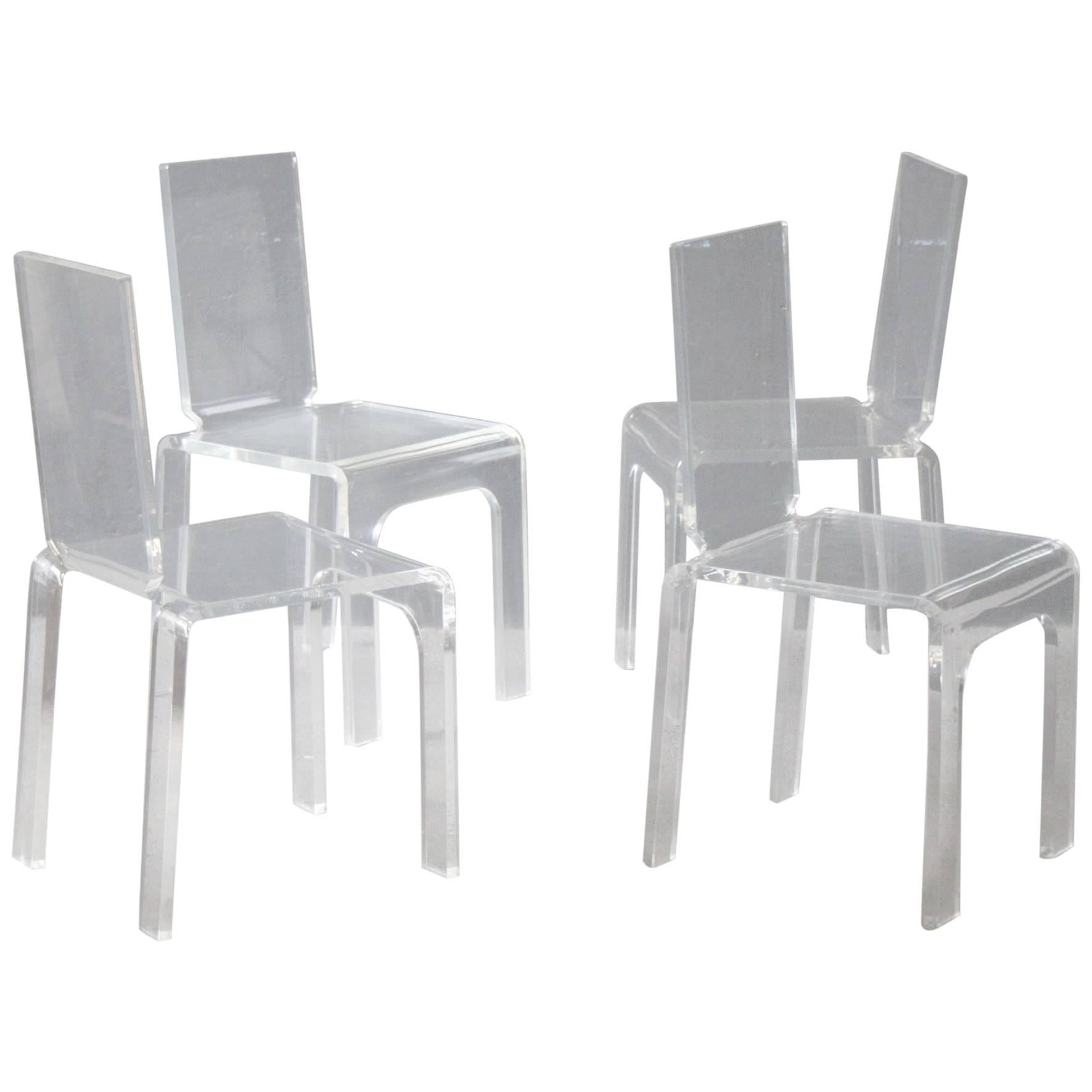 Four Plexiglass Chairs