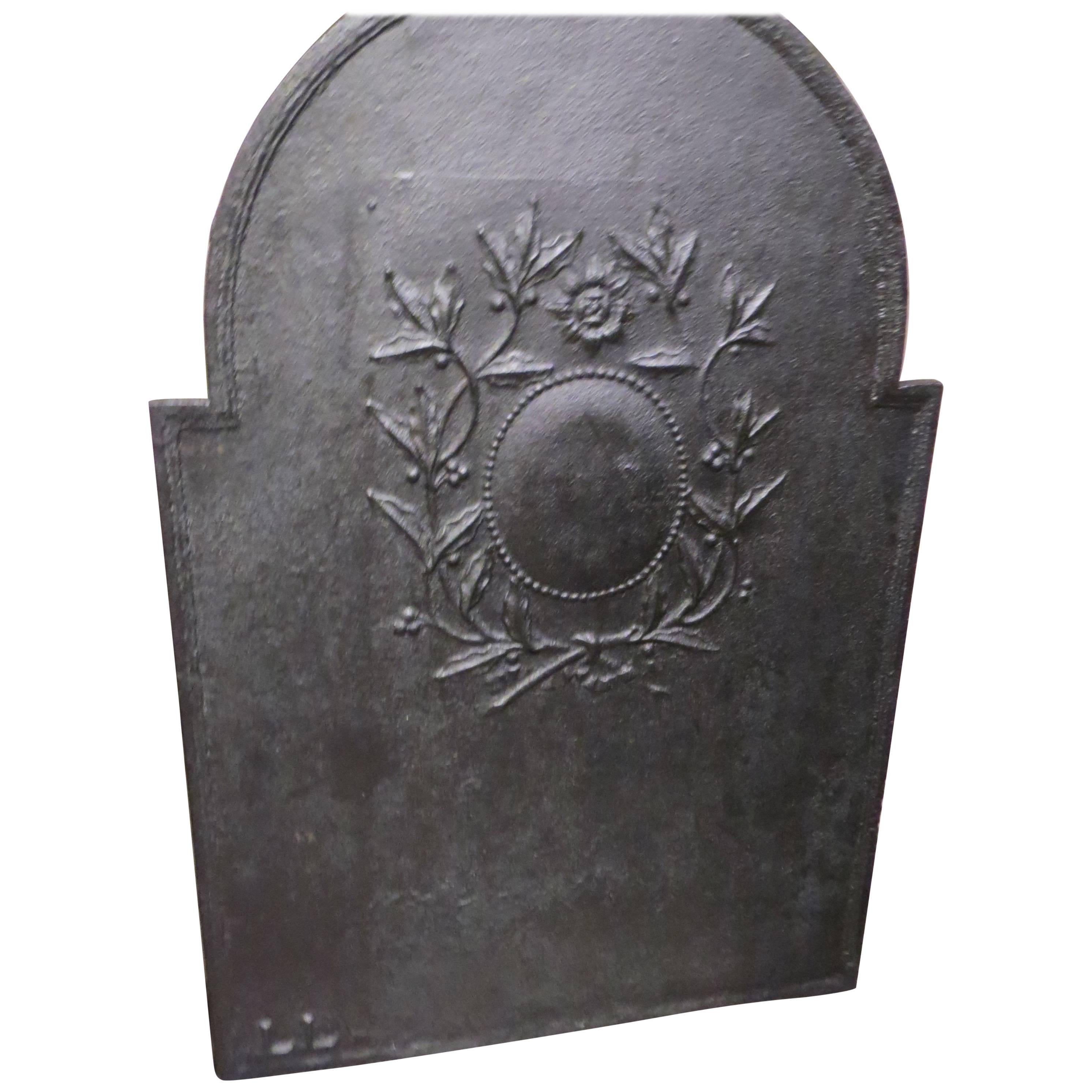 19th Century French Iron Fireback with Wreath Motif For Sale