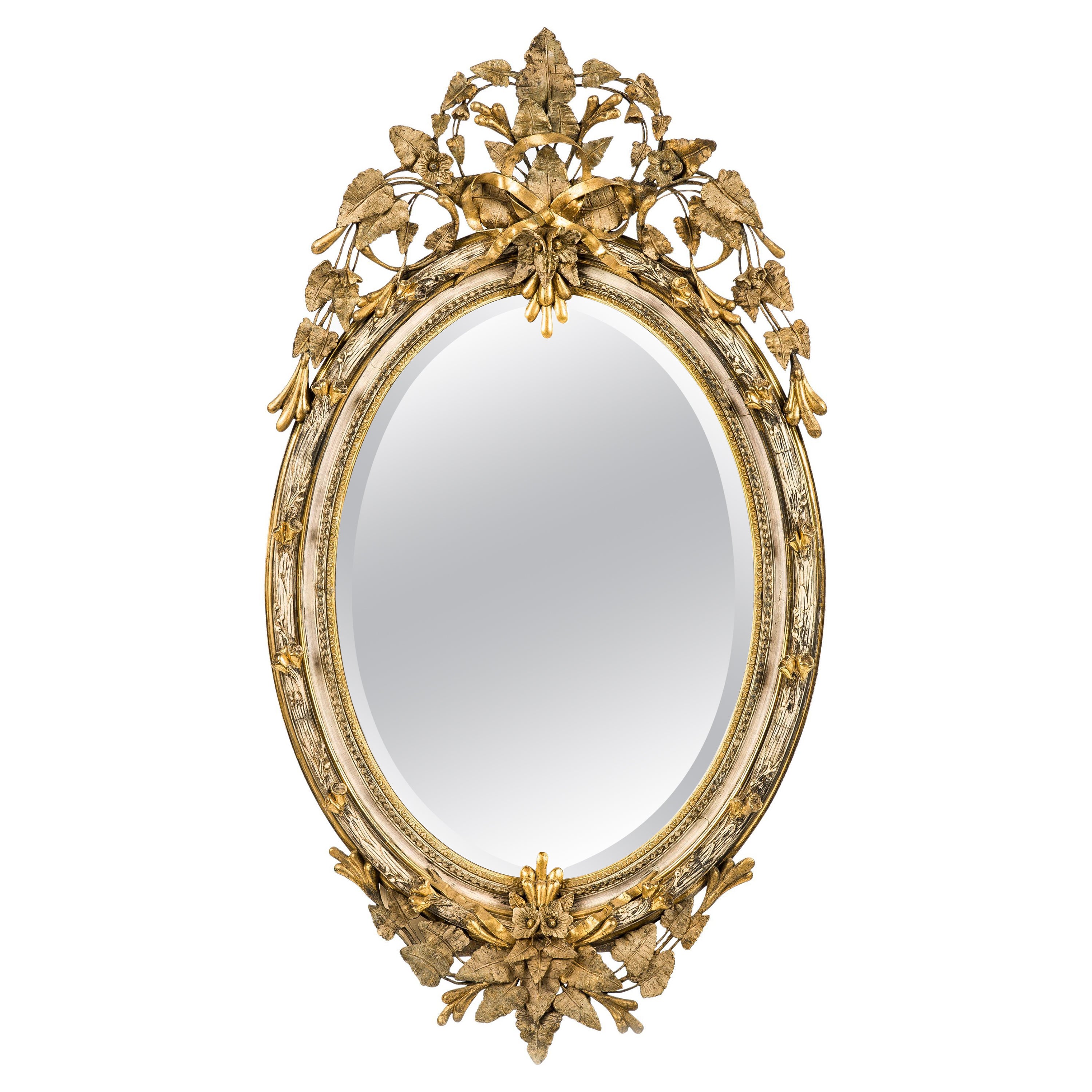 Grand miroir ovale français ancien du 19ème siècle, doré à l'or avec crête