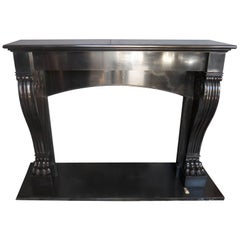 Antique Black Belgian French Fireplace mantle piece with an arched lintle.