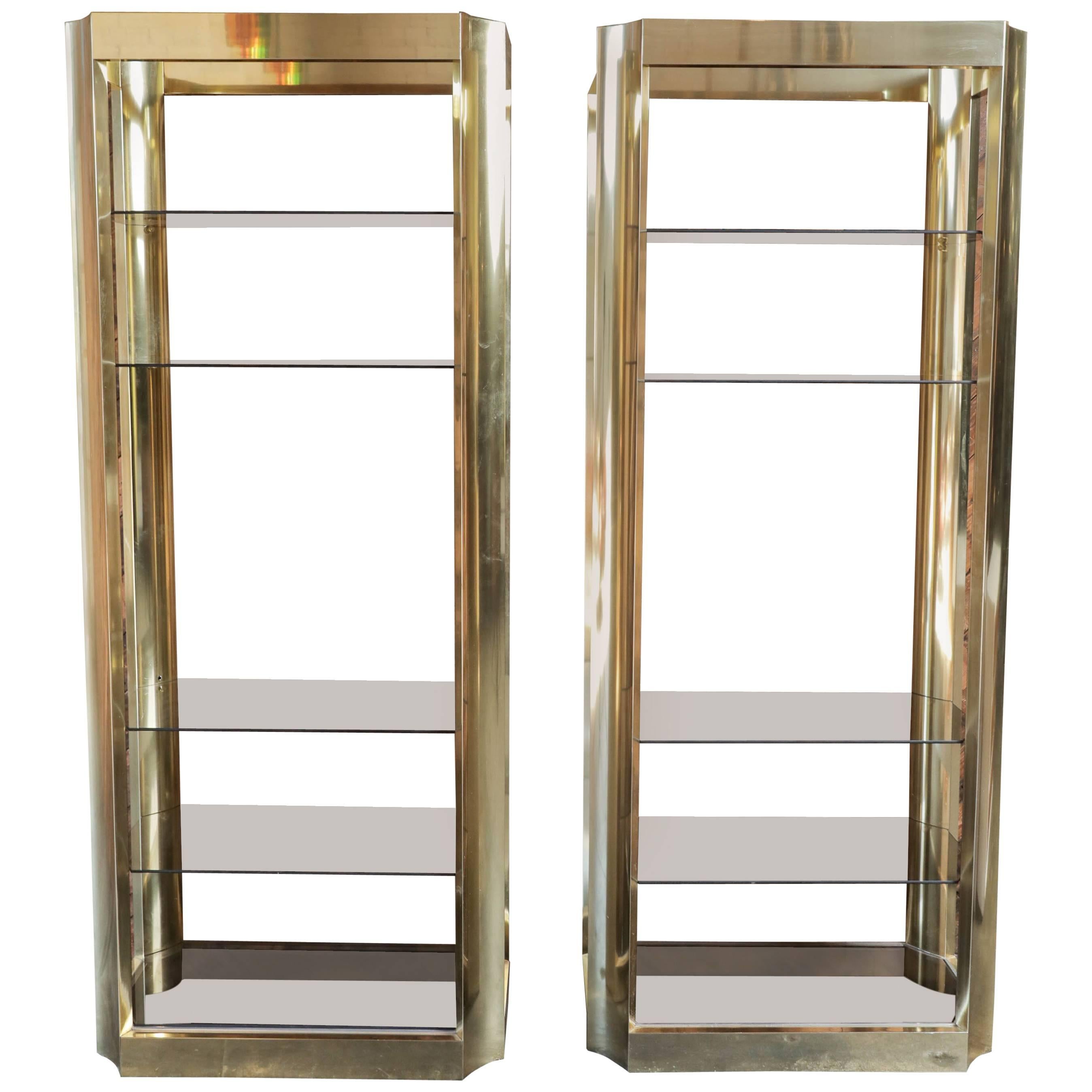 Pair of Brass Etegeres with Smoked Glass Shelves and Beautiful Curved Design For Sale