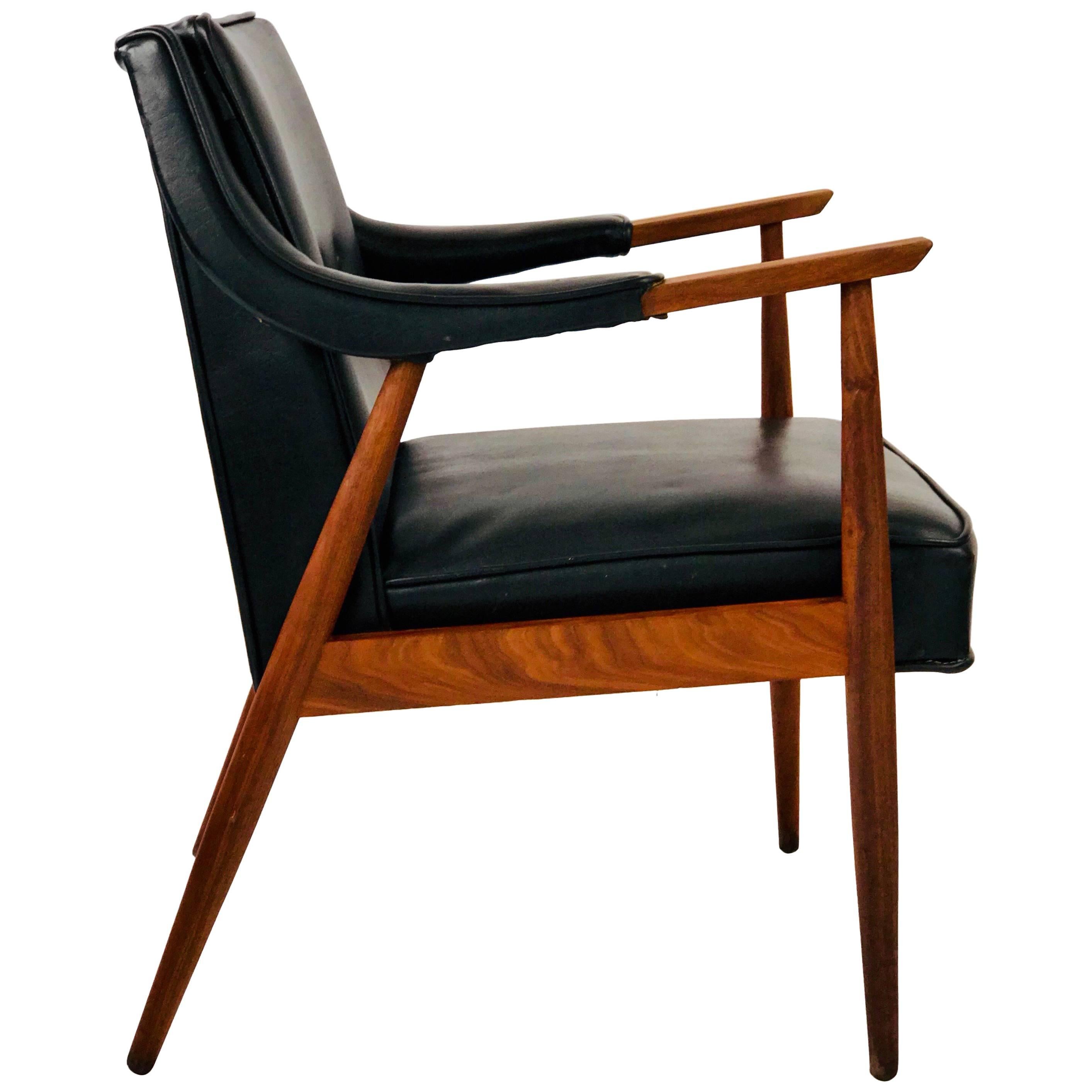 In the style of Jens Risom, this midcentury lounge chair is a classic example of Danish midcentury design. The teak arms and legs have a beautiful grain and flat oiled finish. Overall it is a solid and firm chair in great vintage condition. Original